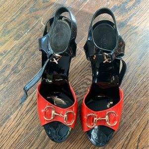 Gucci black and red patent leather platform heels with gold horse-bit detail